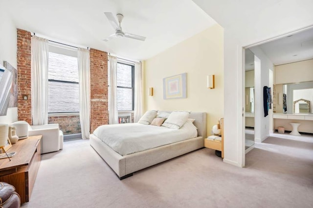 525 W 22nd St Unit 3Af, New York City, NY 10011 - bedroom with carpet floors, brick wall, a ceiling fan, and ensuite bath