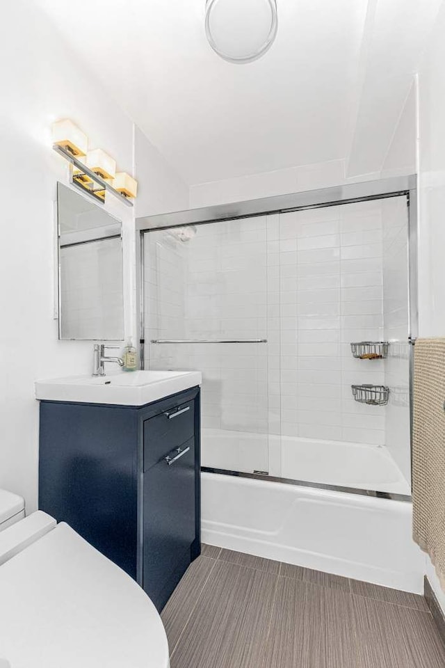 245 E 24th St Unit 14A, New York City, NY 10010 - bathroom with vanity and enclosed tub / shower combo