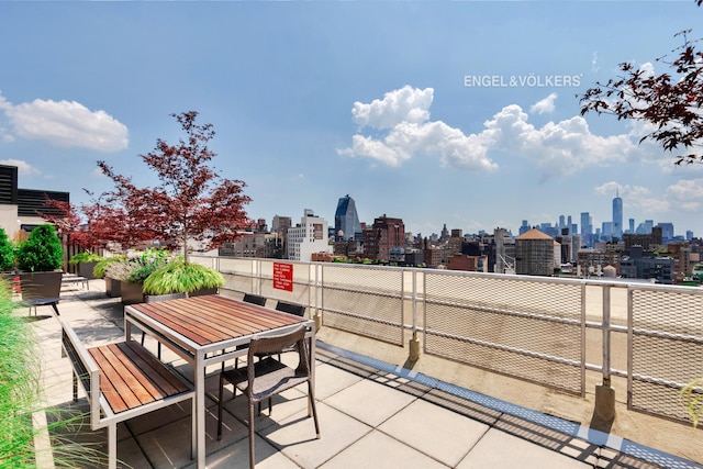 121 W 19th St Unit 3D, New York City, NY 10011 - view of patio featuring a skyline view and outdoor dining area