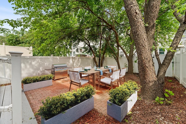 449 Pulaski St, New York City, NY 11221 - fenced backyard with outdoor dining area and a patio area