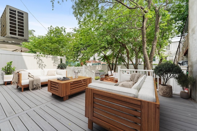 449 Pulaski St, New York City, NY 11221 - wooden deck with an outdoor hangout area and a fenced backyard