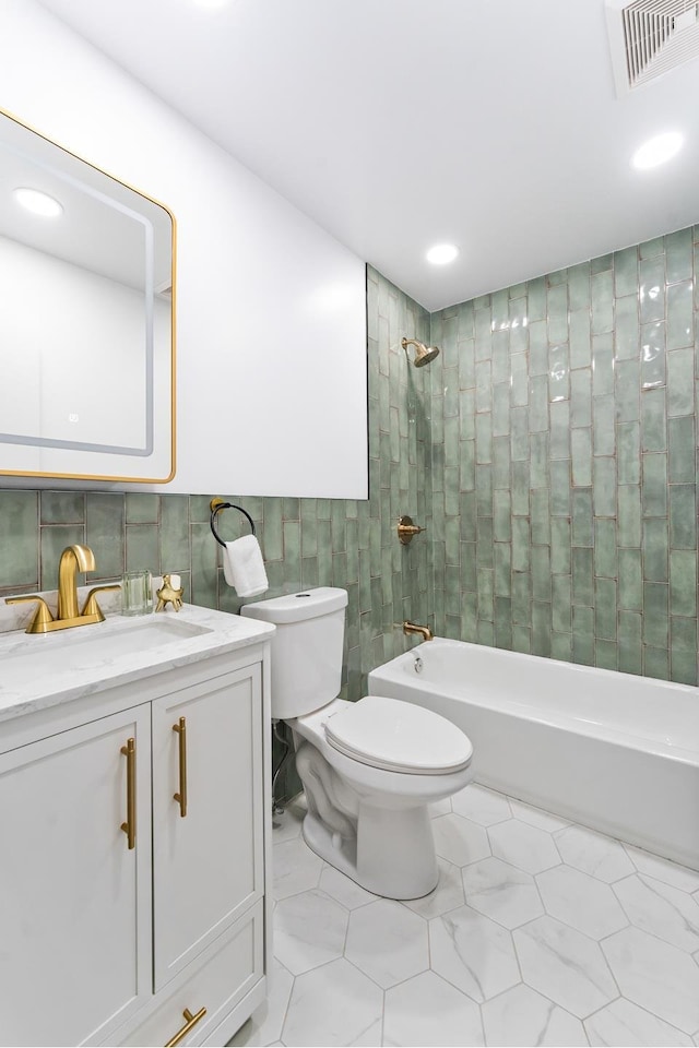449 Pulaski St, New York City, NY 11221 - full bath featuring tile walls, vanity, shower / bath combination, tile patterned floors, and recessed lighting