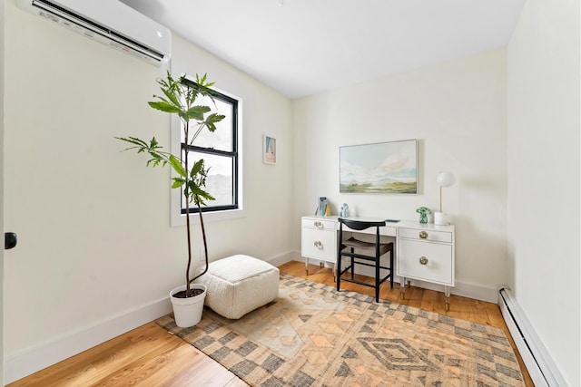 449 Pulaski St, New York City, NY 11221 - home office with a baseboard heating unit, a wall unit AC, and light wood-type flooring