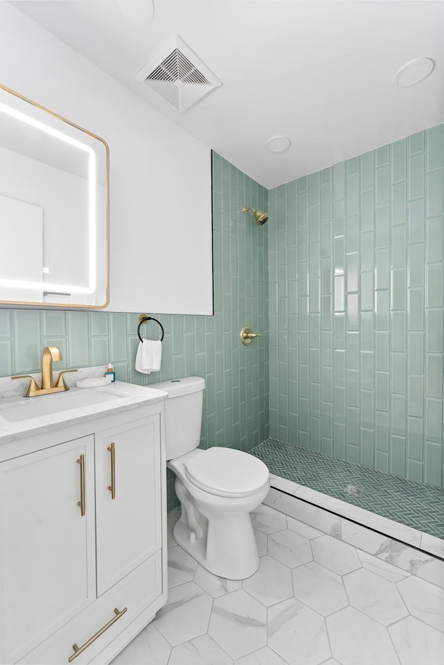 449 Pulaski St, New York City, NY 11221 - bathroom with a stall shower, tile walls, and vanity