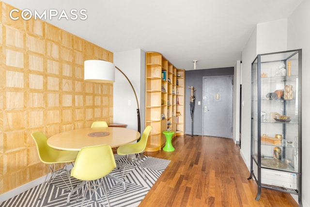 201 E 17th St Unit 31E, New York City, NY 10003 - dining room with wood finished floors and baseboards