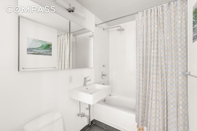 201 E 17th St Unit 31E, New York City, NY 10003 - full bathroom featuring shower / bathtub combination with curtain and toilet