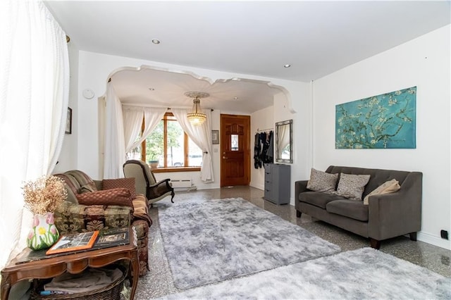 7007 Narrows Ave, New York City, NY 11209 - living area featuring arched walkways, a baseboard heating unit, and recessed lighting