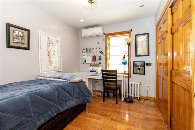 7007 Narrows Ave, New York City, NY 11209 - bedroom featuring a wall unit AC, radiator, and light wood-style flooring