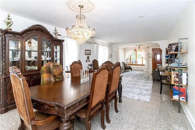 7007 Narrows Ave, New York City, NY 11209 - dining space featuring a chandelier, an AC wall unit, recessed lighting, and arched walkways