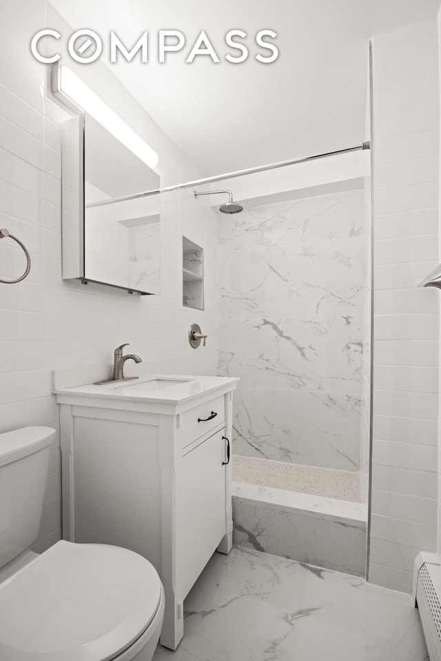 135 Ocean Pkwy Unit 9M, New York City, NY 11218 - full bathroom with marble finish floors, vanity, a marble finish shower, and a baseboard radiator