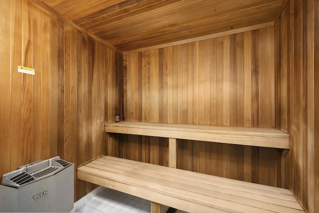 15 W 53rd St Unit 20E, New York City, NY 10019 - sauna with wooden ceiling, wood walls, and tile patterned floors