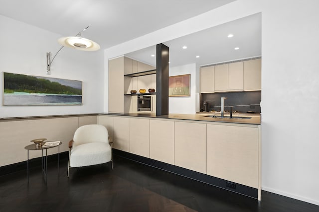 15 W 53rd St Unit 20E, New York City, NY 10019 - kitchen featuring cream cabinetry, recessed lighting, oven, tasteful backsplash, and modern cabinets