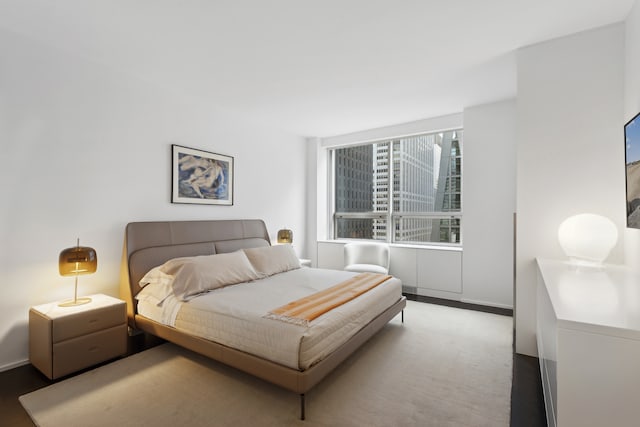 15 W 53rd St Unit 20E, New York City, NY 10019 - bedroom featuring wood finished floors