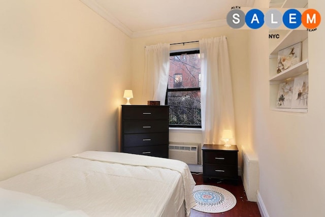 134 W 82nd St Unit 2C, New York City, NY 10024 - bedroom featuring radiator, crown molding, a wall mounted air conditioner, and dark wood-type flooring