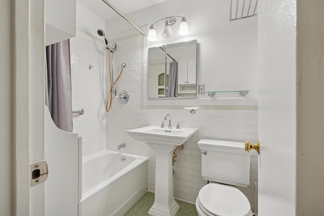 320 E 35th St Unit 2H, New York City, NY 10016 - full bathroom with shower / tub combo, tile walls, and tile patterned floors