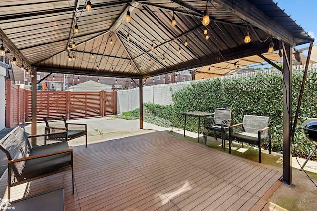 31-28 56th St, New York City, NY 11377 - wooden deck featuring a gazebo, a fenced backyard, and a patio area
