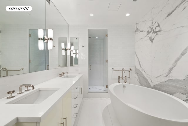 146 W 57th St Pha, Pha, New York City, NY 10019 - full bathroom featuring a stall shower, a freestanding tub, tile walls, and double vanity