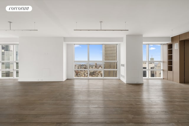 146 W 57th St Pha, Pha, New York City, NY 10019 - spare room featuring dark wood-type flooring and healthy amount of natural light