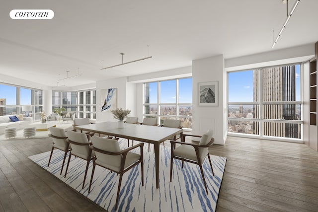 146 W 57th St Pha, Pha, New York City, NY 10019 - dining space with hardwood / wood-style flooring and healthy amount of natural light