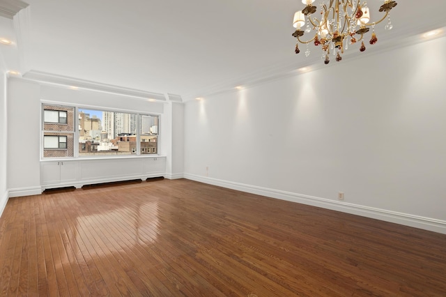 340 E 64th St Unit 9-B, New York City, NY 10065 - empty room with ornamental molding, dark wood-type flooring, and a chandelier