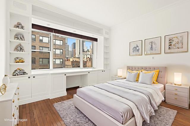 340 E 64th St Unit 9-B, New York City, NY 10065 - bedroom featuring wood-type flooring and ornamental molding