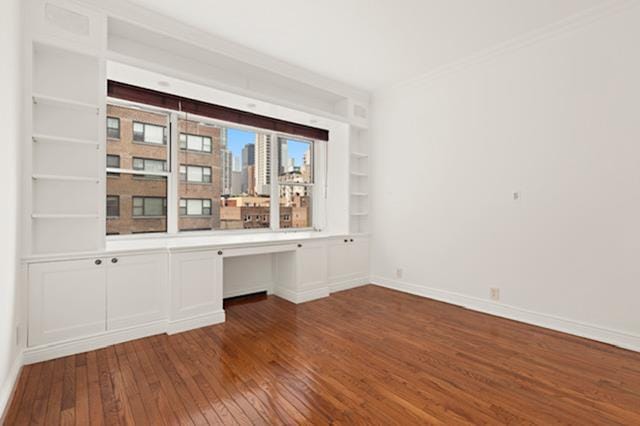 340 E 64th St Unit 9-B, New York City, NY 10065 - unfurnished office with dark wood-style flooring and crown molding