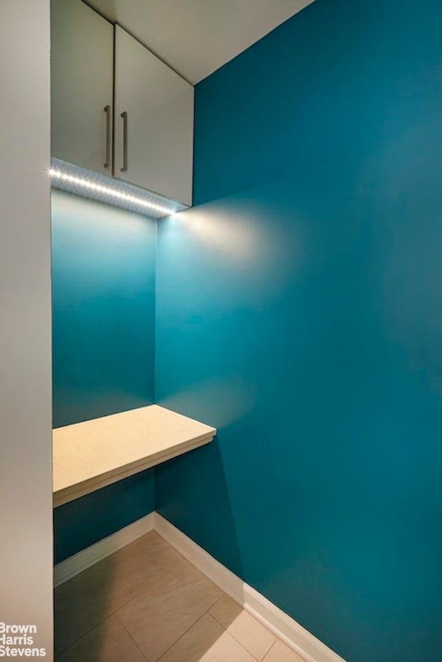 63 E 9th St Unit 9G, New York City, NY 10003 - bathroom with tile patterned floors and baseboards