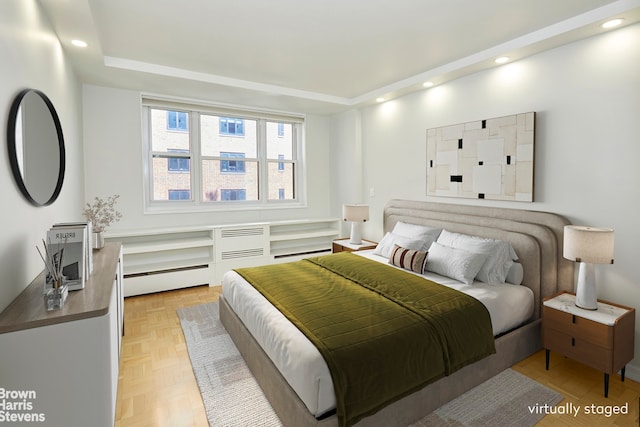 63 E 9th St Unit 9G, New York City, NY 10003 - bedroom featuring a baseboard radiator, recessed lighting, and a wall mounted AC