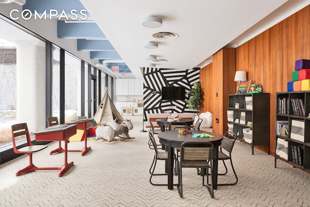 184 Kent Ave Unit B503, New York City, NY 11249 - carpeted dining space featuring wood walls