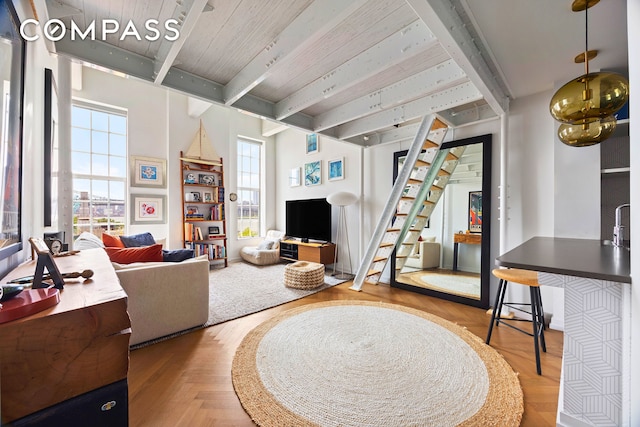 184 Kent Ave Unit B503, New York City, NY 11249 - living room featuring a wooden ceiling with exposed beams and stairway