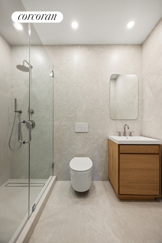 184 Hawthorne St Unit 4B, New York City, NY 11225 - bathroom featuring a stall shower, tile walls, and vanity