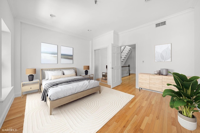 248 E 33rd Street Townhouse, New York City, NY 10016 - bedroom featuring crown molding, light wood-type flooring, and recessed lighting