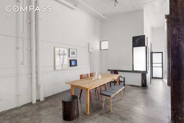 125 Watts St Unit 1, New York City, NY 10013 - dining space featuring concrete floors and a towering ceiling