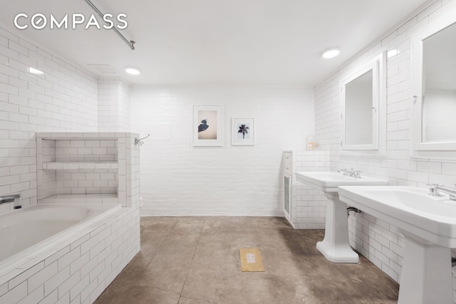 125 Watts St Unit 1, New York City, NY 10013 - full bath featuring tiled bath, tile patterned floors, and tile walls