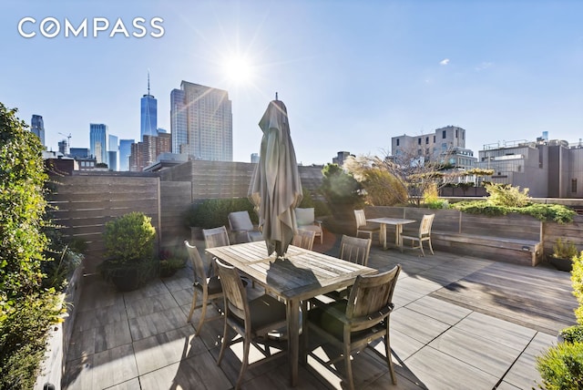 125 Watts St Unit 1, New York City, NY 10013 - deck featuring outdoor dining area and a skyline view