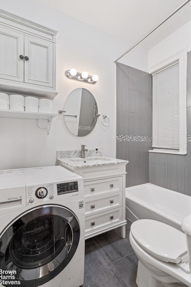 433 W 46th St Unit 1Rw, New York City, NY 10036 - bathroom with washer / clothes dryer, vanity, and shower / bathtub combination