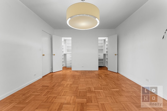 457 Fdr Dr Unit A604, New York City, NY 10002 - unfurnished bedroom with a walk in closet and baseboards