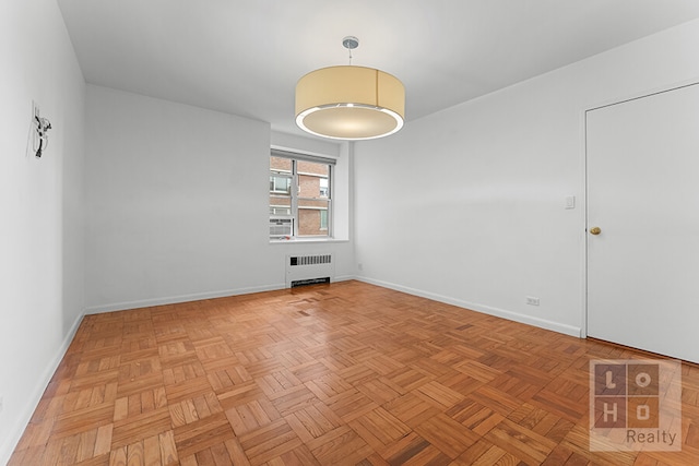 457 Fdr Dr Unit A604, New York City, NY 10002 - unfurnished room with radiator heating unit and baseboards