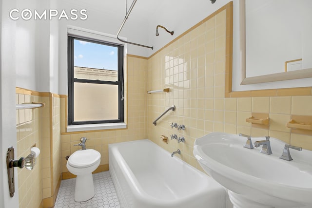 200 Pinehurst Ave Unit 5C, New York City, NY 10033 - full bath featuring tile walls, tile patterned flooring, and bathing tub / shower combination