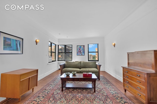 200 Pinehurst Ave Unit 5C, New York City, NY 10033 - living room featuring healthy amount of natural light and wood finished floors