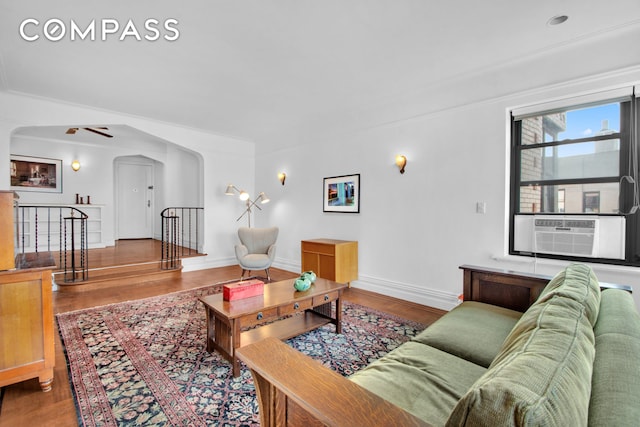200 Pinehurst Ave Unit 5C, New York City, NY 10033 - living area with arched walkways, wood finished floors, and cooling unit
