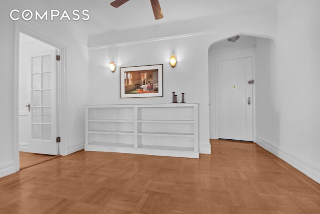 200 Pinehurst Ave Unit 5C, New York City, NY 10033 - spare room featuring arched walkways and a ceiling fan