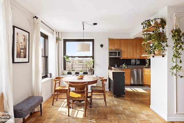205 Clinton Ave Unit 11F, New York City, NY 11205 - dining space with baseboards