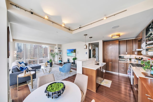 60 Riverside Blvd Unit 2402, New York City, NY 10069 - dining room with track lighting and dark wood-style floors