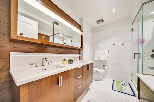 60 Riverside Blvd Unit 2402, New York City, NY 10069 - bathroom featuring double vanity, a stall shower, and marble look tile flooring
