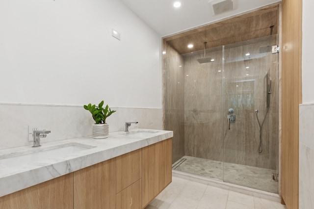 53 W 119th St Unit 1, New York City, NY 10026 - full bathroom with a stall shower, double vanity, and recessed lighting