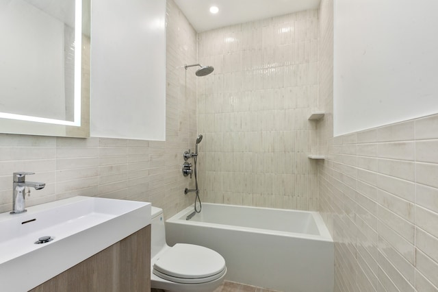 53 W 119th St Unit 1, New York City, NY 10026 - bathroom featuring tile walls, vanity, and washtub / shower combination