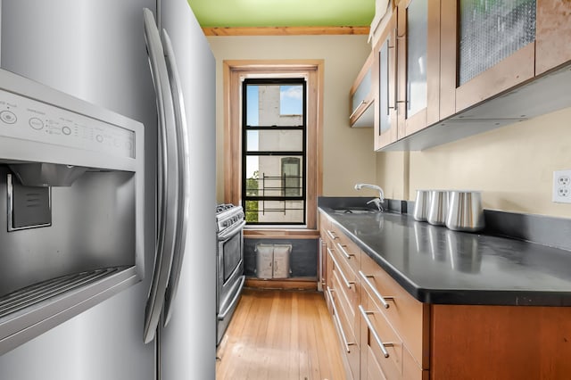 110 Cambridge Pl Unit 5-B, New York City, NY 11238 - kitchen with appliances with stainless steel finishes, stainless steel countertops, light wood finished floors, and glass insert cabinets