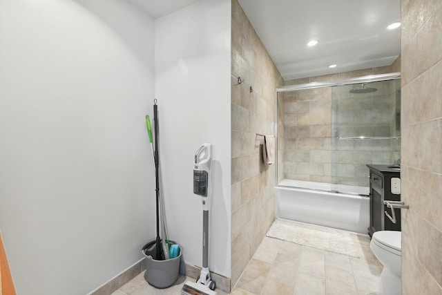 322 W 57th St Unit 18J, New York City, NY 10019 - full bath with recessed lighting, bath / shower combo with glass door, tile patterned floors, and tile walls