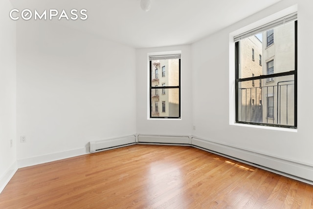 305 W 150th St Unit 511, New York City, NY 10039 - unfurnished room with wood finished floors and plenty of natural light